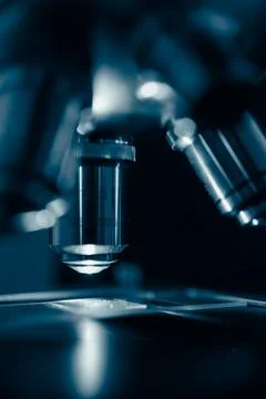 Scientific microscope in modern clean laboratory light Stock Photos