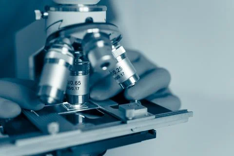 Scientific microscope in modern clean laboratory light Stock Photos