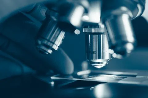 Scientific microscope in modern clean laboratory light Stock Photos