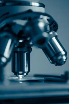 Scientific microscope objective in lab light Stock Photos