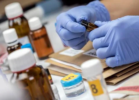 Scientific Police takes blood sample at Laboratorio forensic equipment, conce Stock Photos