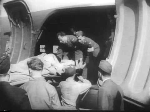 The scientific process for making penicillin is shown, and wounded soldiers are Stock-Footage 75191318