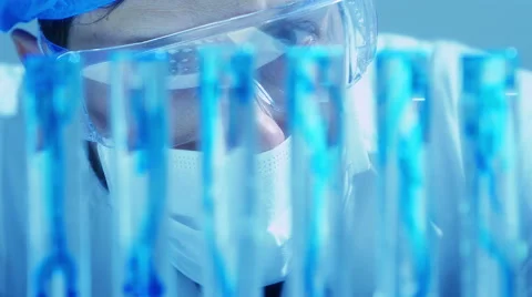Scientific research: chemical laboratory: scientist at work with test tubes Stock Footage