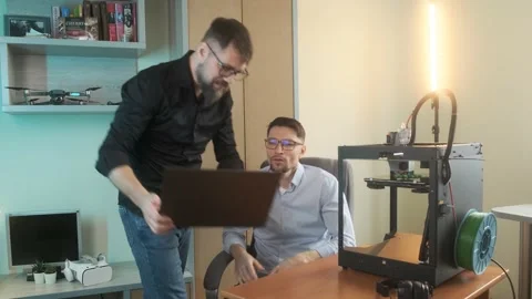 Scientific research young men create models using 3D printer Stock Footage 236616209