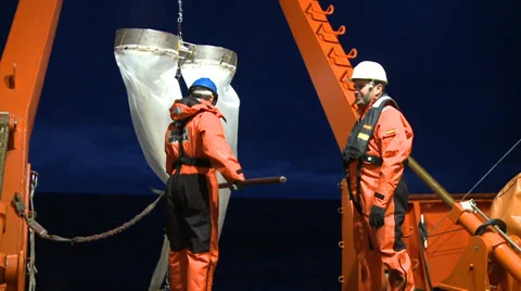 Scientific taking samples of an ocean microorganisms from a Bongo nets Stock Footage 36440433
