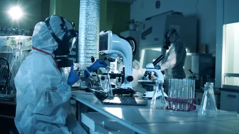 Scientific worker is operating computerized equipment. Medical research of Stock Footage 129391816