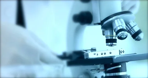 Scientist adjusting microscope for experiment. Stock Footage 102478898