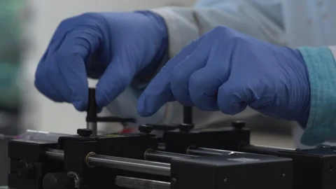 Scientist adjusting a piece of equipment Stock Footage 106901293