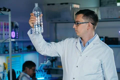 Scientist is analysing and testing a water concept. Stock Photos