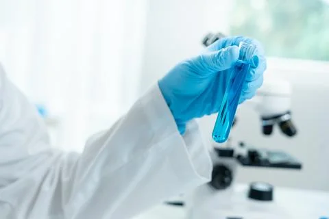 Scientist analyze biochemical sample in advanced scientific laboratory. Med.. Stock Photos