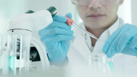 Scientist analyze biochemical samples in advanced scientific laboratory. Medical Stock Footage 229228482
