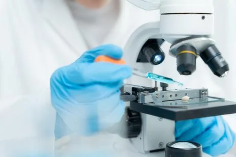 Scientist analyze biochemical samples in advanced scientific laboratory. Me.. Stock Photos