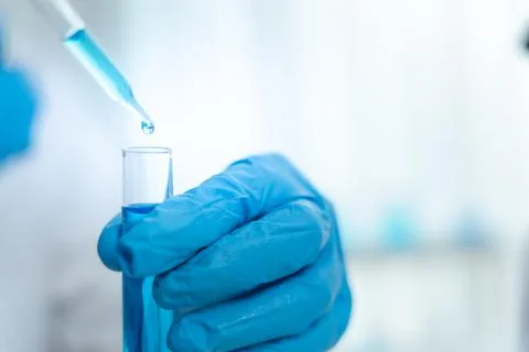 Scientist analyze biochemical samples in advanced scientific laboratory. Me.. Stock Photos