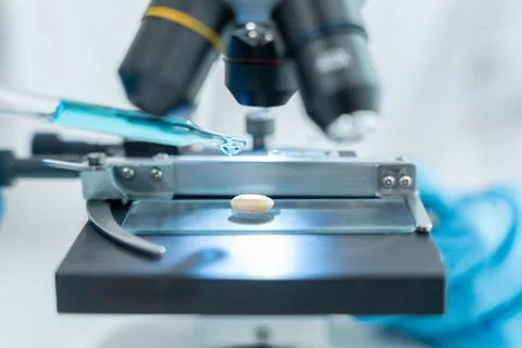 Scientist analyze biochemical samples in advanced scientific laboratory. Me.. Stock Photos