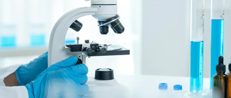 Scientist analyze biochemical samples in advanced scientific laboratory. Me.. Stock Photos
