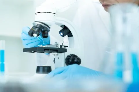 Scientist analyze biochemical samples in advanced scientific laboratory. Me.. Stock Photos
