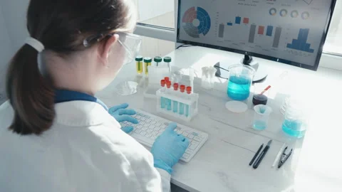 The scientist analyzes data in a large medical database using computer Vidéo 240329547