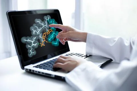 Scientist analyzing 3D molecular docking model on laptop screen for drug di.. Stock Photos