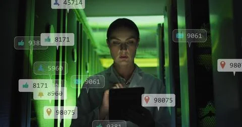 Scientist analyzing data on tablet in server room with digital notifications Stock Photos
