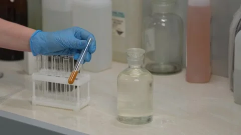 Scientist Analyzing Liquid Sample in Test Tube Stock Footage 303369342