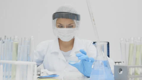 Scientist analyzing a petri dish sample. Stock Footage 147060786