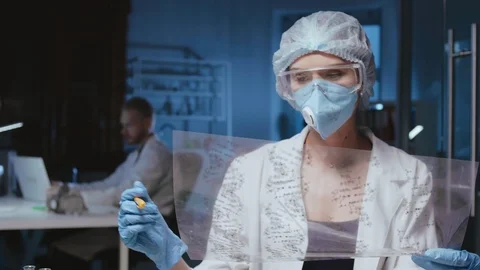 Scientist analyzing a snapshot in DNA laboratory Stock-Footage 95026980