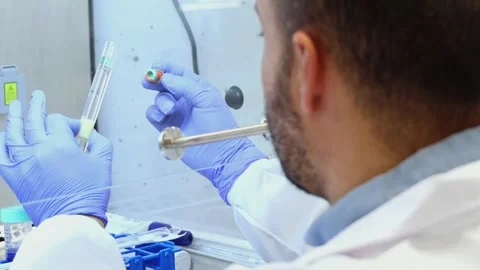 Scientist analyzing test tube in laboratory environment Stock Footage 296884390