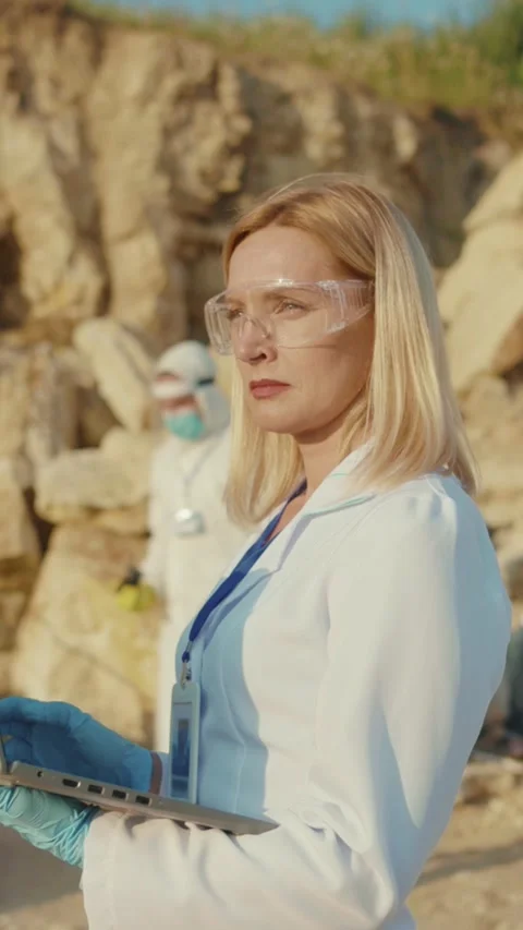A scientist is analyzing vital data at a coastal site to support environmental Stock Footage 314207551