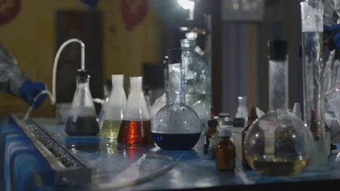 The scientist and his assistant conduct chemical experiments in an underground Stock Footage 76773069