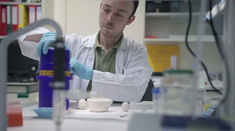 Scientist and steaming cold liquid Stock Footage 1750249