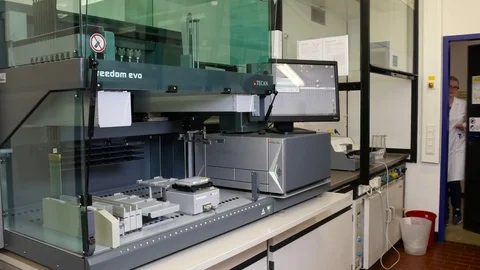 Scientist at the automatic pipette Stock-Footage 79857660