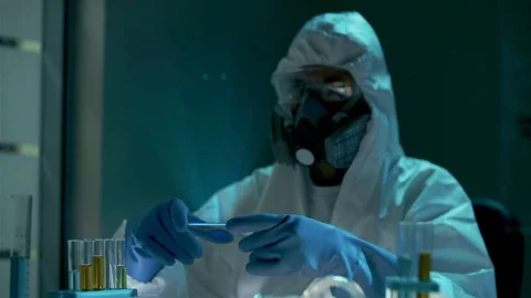 Scientist of bio engineering technology or chemistry in protective clothes is Stock Footage 72511554