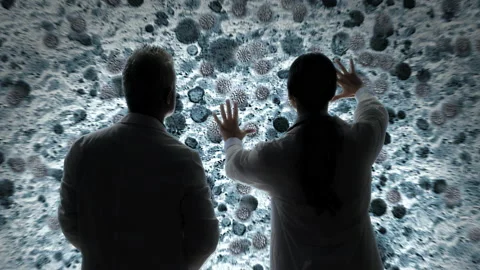 Scientist biologist analyzing covid 19 cells attack on microscope image 스톡 동영상 164522546