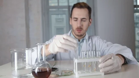 Scientist biologist with the vial in hand Stock-Footage 73111172