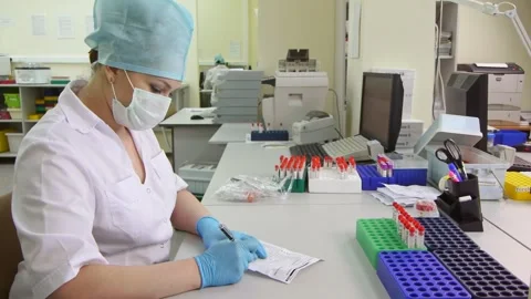 Scientist in biotechnological laboratory Stock Footage 264956600