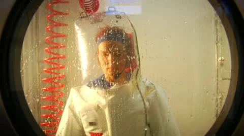 Scientist in bubble suit in airlock Stock Footage 21532428