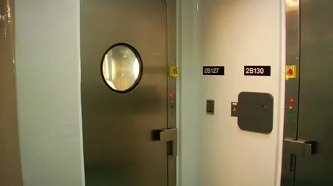 Scientist in bubble suit exits airlock Stock Footage 21533027