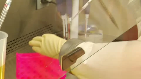 Scientist in bubble suit works with samples Video stock 21534174