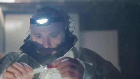Scientist carefully analyzes collected sample material. Expert carefully Stock Footage 346522504