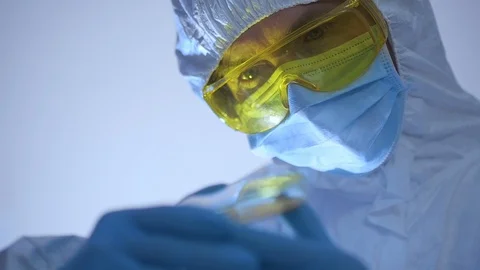 Scientist carefully opens Petri dish with dangerous bacteria. Stock Footage 106263868