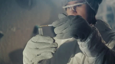Scientist carefully transfers sample with precision. Researcher precisely Stock Footage 346474657