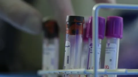 Scientist checking cylinder labels Stock Footage 20446586