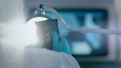 Scientist checking hard disk drive in laboratory Stock Footage 149244141