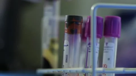 Scientist checking liquids in cylinders Stock Footage 20446598