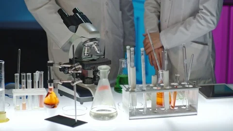 Scientist Checking Work of Apprentice Video stock 71004919