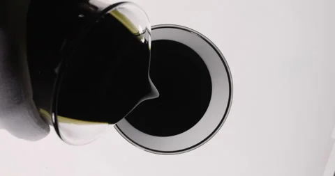 Scientist chemist pouring used engine oil from glass into beaker., Top view Stock Footage 338436474