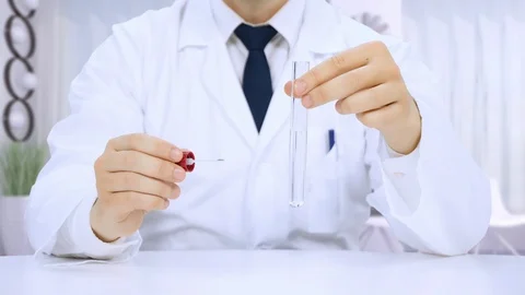 Scientist chemist working at a laboratory experiments Video stock 109382628