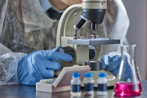 Scientist, chemist working with microscope in pharmaceutical laboratory. Th.. Stock Photos