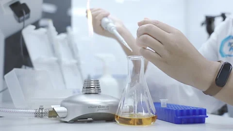 Scientist Collect sample sollution sterillize flame laboratory 50fps Stock-Footage 247403302