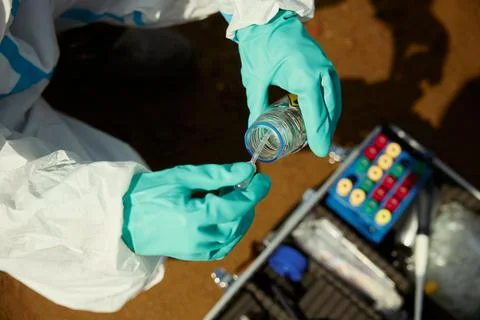 Scientist Collecting Liquid Soil Sample for Environmental Analysis Stock Photos